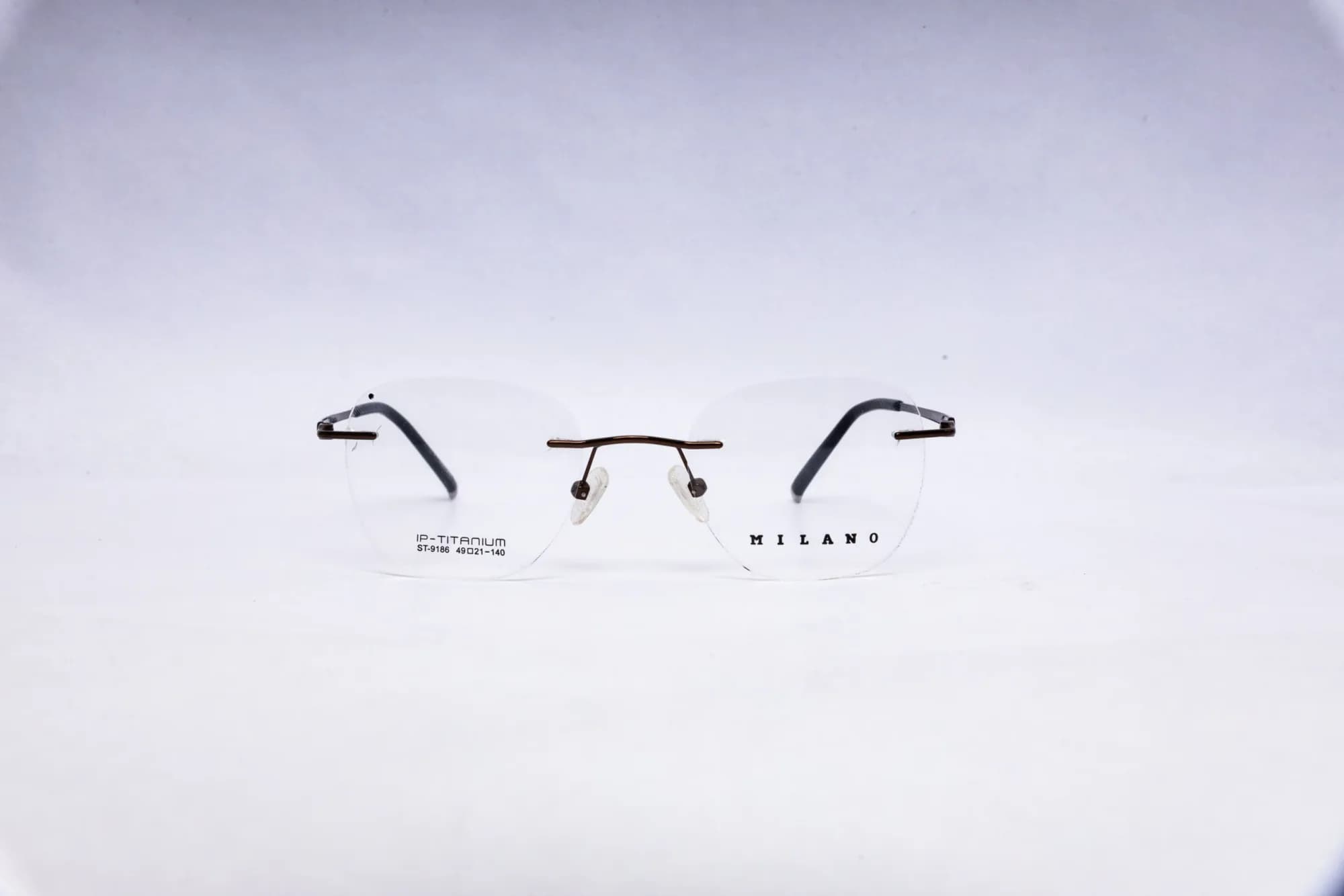 MILANO Rimless Round Silver Titanium Eyeglasses - front view